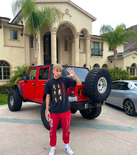 Santea posing with car